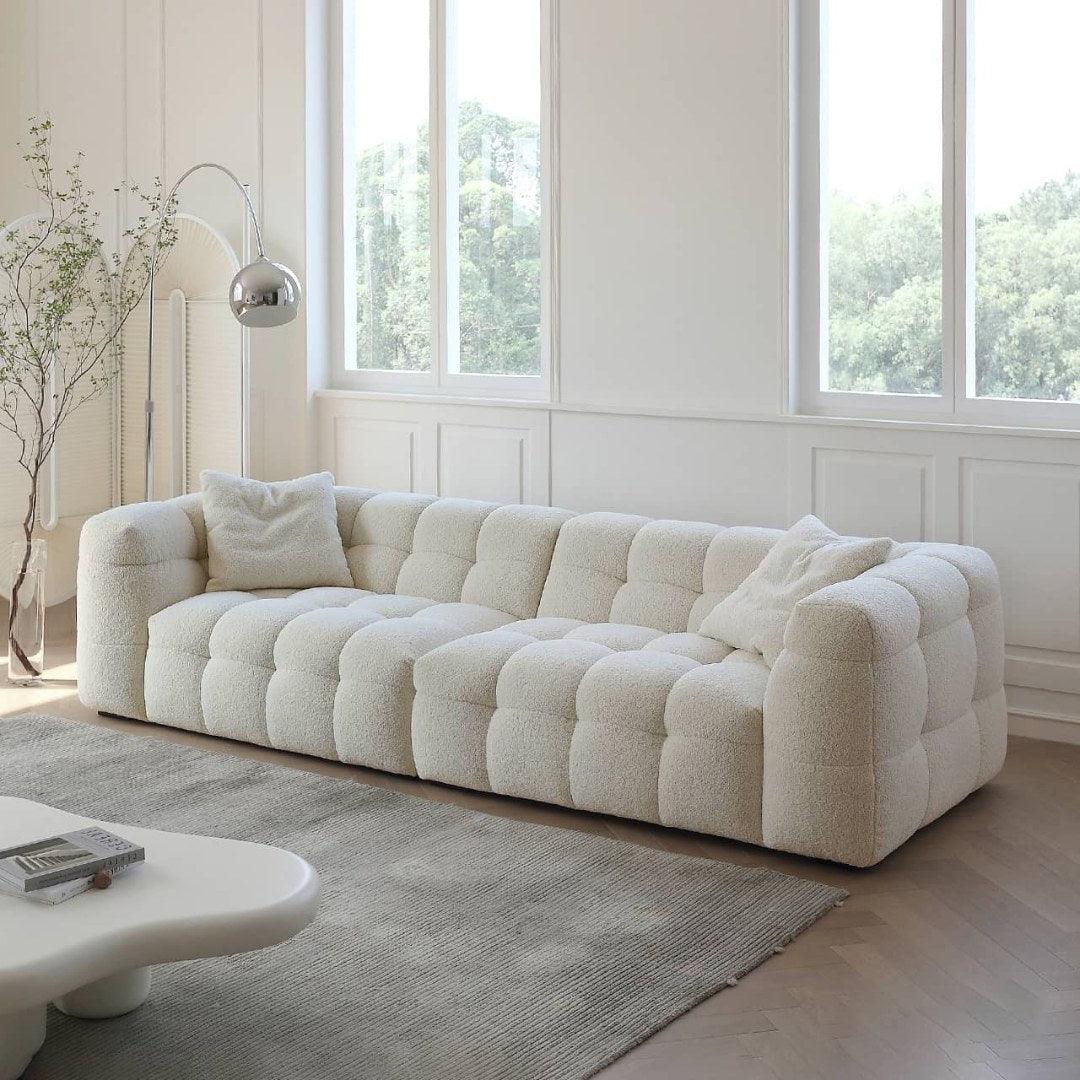 Boxy Cloud Sofa in off-white boucle fabric placed in a modern living room with natural light, ideal for luxury homes in Dubai and UAE.