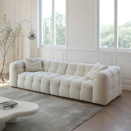 Boxy Cloud Sofa in off-white boucle fabric placed in a modern living room with natural light, ideal for luxury homes in Dubai and UAE.